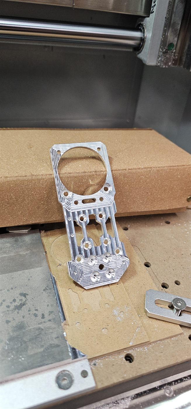 Machined aluminium tool plate, clamped in the milling machine