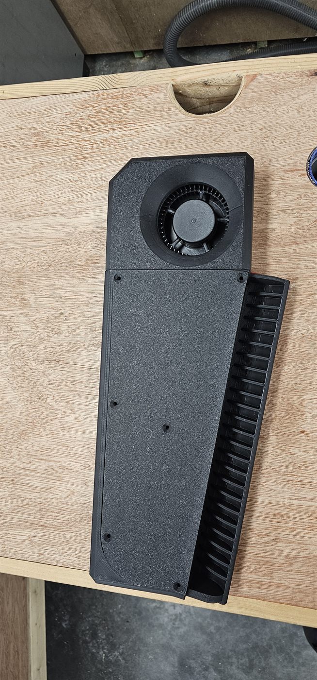 The assembled unit, blower and heat exchanger mounted in the printed housing
